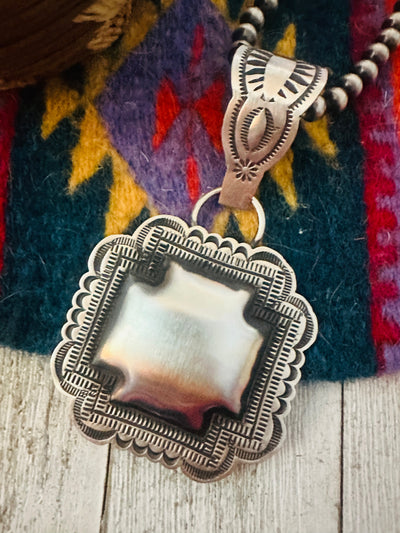 Handcrafted Sterling Silver Cross Concho Pendant by Leander Tahe