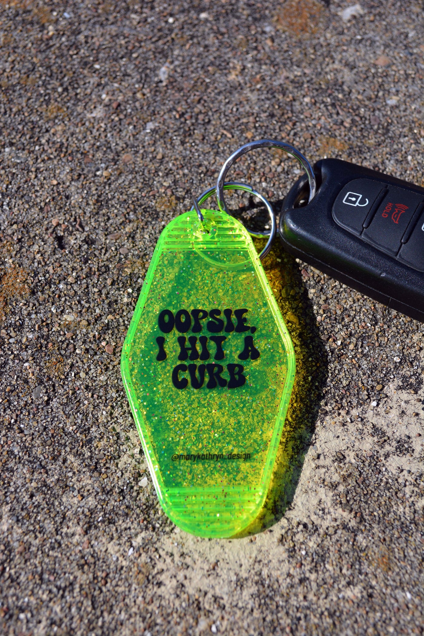 Oopsie, I Hit A Curb Keychain (Neon Yellow Glitter)