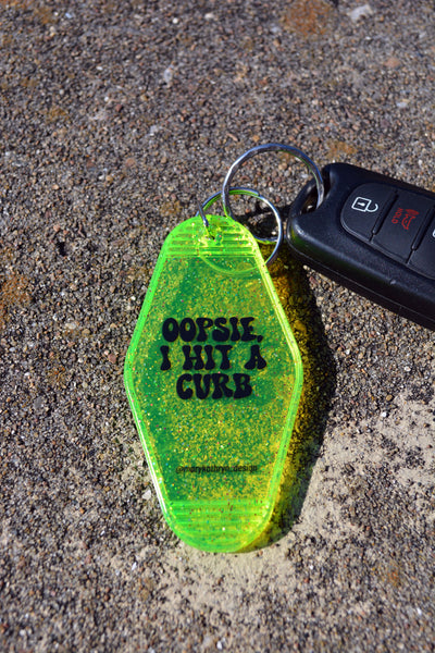 Oopsie, I Hit A Curb Keychain (Neon Yellow Glitter)